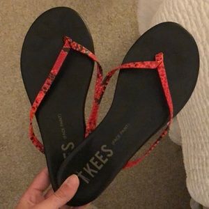 Red snakeskin tkee sandals